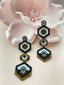 Pendientes de flores de mal de ojo